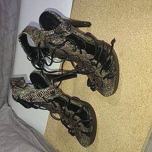 Nadara Chic Black and Brown Heels with Strappy Design and High Stiletto